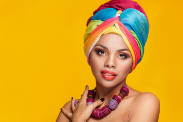 Gorgeous afro-american girl in national turban - obrazy, fototapety, plakaty