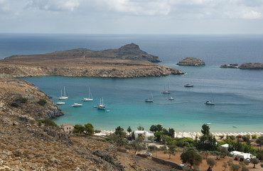 Fototapeta na wymiar Bay of Lindos , Rhodes Island, Greece. Lindos is town on the island of Rhodes, in the Dodecanese, Greece. Above the modern town rises the acropolis of Lindos. 