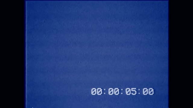 An old bad VHS tape playing. Blue screen with timecode. A vintage background for videos, a retro element.

