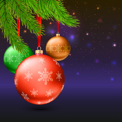 Christmas balls, green fir branches and bright background