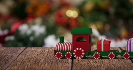 Obraz premium Composite image of train set with gift boxes