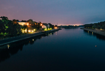Fototapeta na wymiar River in the evening reflections in night illumination