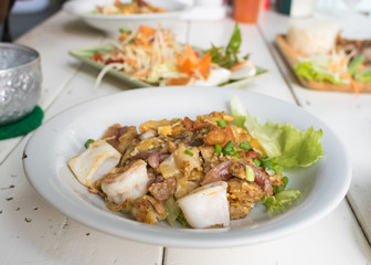 Thai food Stir fried rice noodle with chicken,squid and shrimp i