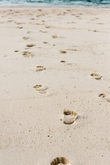 Way of human footprints on the beach sand