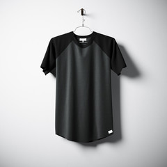 Blank cotton tshirt of black and gray colors hanging in center empty concrete wall. Clear label mockup with highly detailed textured materials. Square. Front side view. 3D rendering.