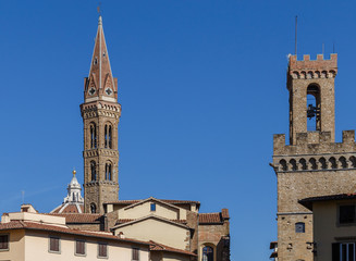 Fototapeta premium Silhouettes of Florence, two towers and roofs against the blue sky