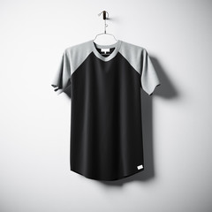 Blank cotton tshirt of black color hanging in center empty concrete wall. Clear label mockup with highly detailed textured materials. Square. Front side view. 3D rendering.