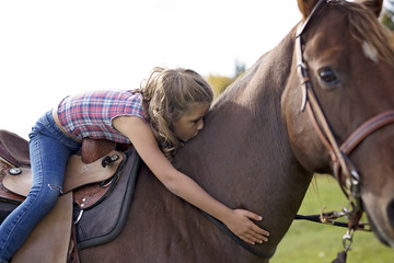 Autumn season young girl and horse