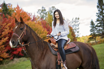 Fototapeta premium Beautiful girl with black hair horse