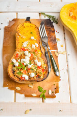 Pumpkin stuffed with couscous, zucchini and cheese