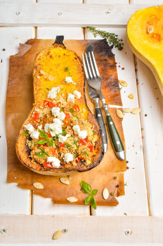 Pumpkin stuffed with couscous, zucchini and cheese