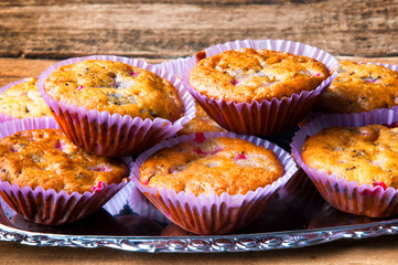 Tasty homemade muffins on silver tray