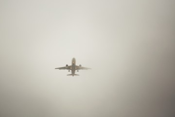 Airplane in thick fog