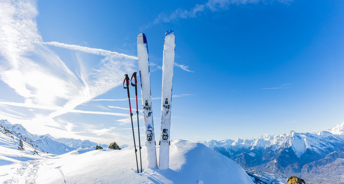 Ski in winter season, mountains and ski touring equipments on th