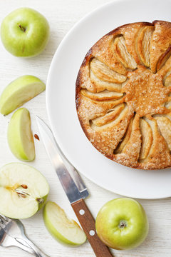 Homemade apple pie on white table