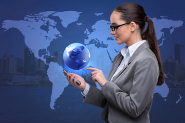 Businesswoman with phone in global business concept