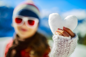 I love winter. Happy winter girl wearing knitted wear scarf. Exc