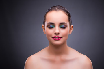 Woman in beauty concept on gray background