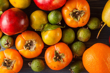 Assorted pile of different colorful fake fruits and vegetables