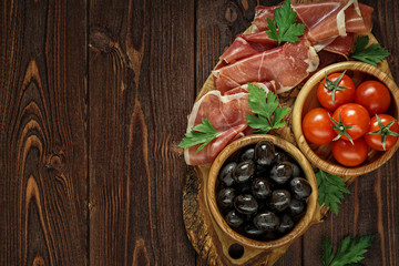 Plate with snack - prosciutto, jamon, ham.