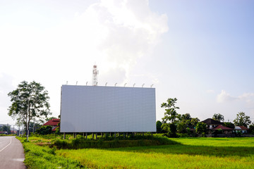 Big blanked bilboard on field at country roadside