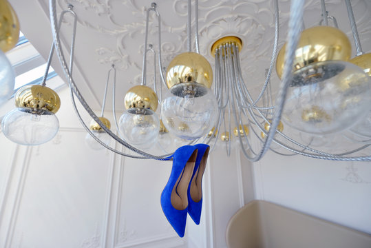 Beautiful colorful wedding shoes for bride indoors. Beauty of bridal heel for marriage. Female couple boots for celebration