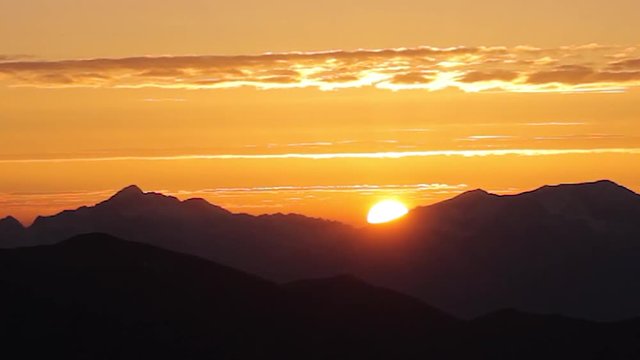 Amazing colorful  sunset  mountain chain. Time lapse sky background. Beautiful fiery sunset 

