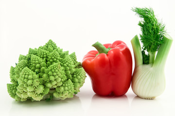 Organic vegetables and fruits in wicker basket isolated
