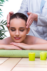 Obraz na płótnie Canvas Woman during massage session in spa salon
