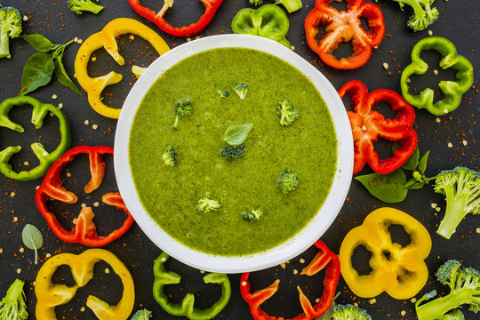 Delicious And Healthy Soup Cream Of Broccoli With Colored Peppers On Background. Vegetarian Food. Top View. 