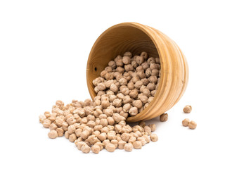 Overturned wooden bowl with chickpeas on white background