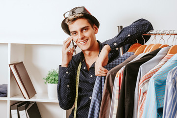 personal shopper with the phone in the textile workshop