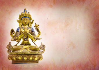 Four hands buddha statue on grunge background, Vajrayana buddhism