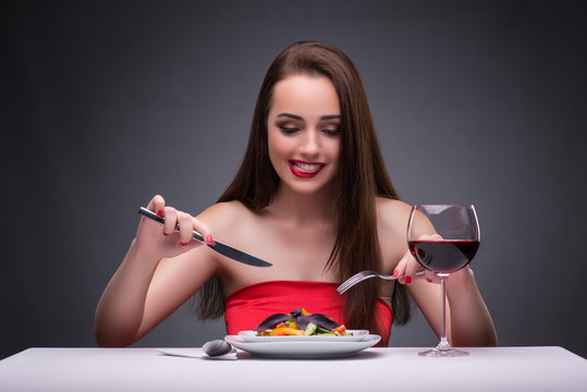 Beautiful Woman Eating Alone With Wine