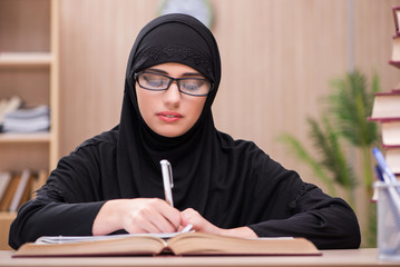 Woman muslim student preparing for exams