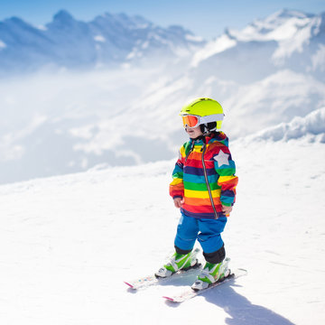 Little child skiing in the mountains