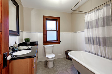 Fototapeta na wymiar Simple style renovated bathroom interior in old American house