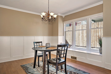 Interior of dining room  with black table and two chairs