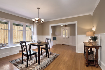 Interior of dining room  with black table and two chairs