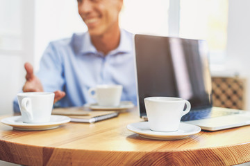 Senior businessman has appointment in cafeteria