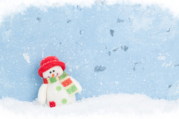 Christmas snowman in snow