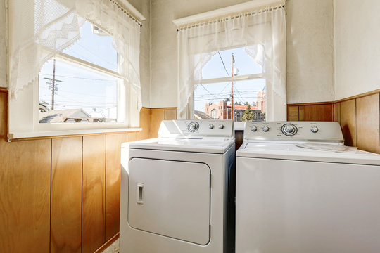 Old house laundry room interior with old fashioned appliances