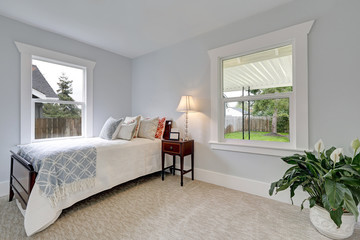 Bright neatly arranged bedroom