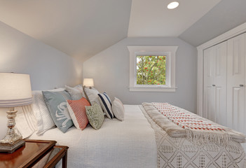 Simply furnished Attic bedroom interior
