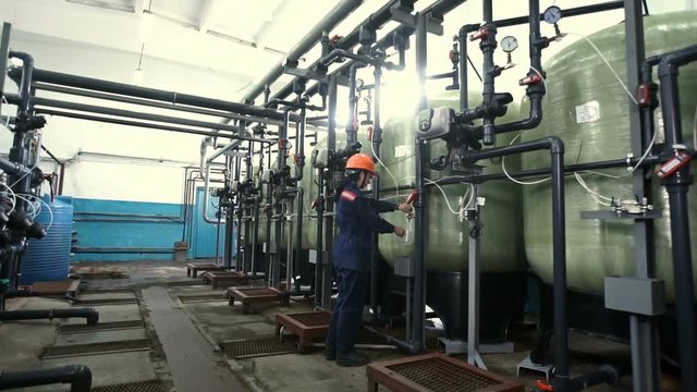 boiler heating system inspection. boiler maintenance or gas equipment at the plant. Modern pipes intertwined, and consortium, technologically. Perhaps the oil derrick. Work turns the pipe valve