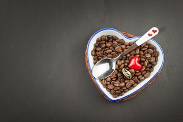 Romantic coffee. Marriage proposal. Coffee beans and a gold ring. Breakfast for lovers. Declaration of love on Valentine's Day.
