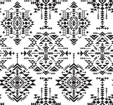Black and white ethnic seamless pattern with geometric shapes.