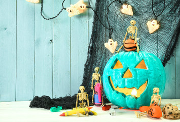 Teal Jack O Lantern  symbolizing non food treats for Halloween
