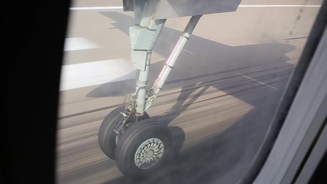 view of the chassis through an airplane window.