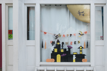 San francisco, USA - October 13, 2016: Cute kids paper crafts display at nursery house's window for celebrating on October 31, Halloween day.